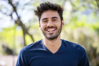 Satisfied man smiling in a casual home setting